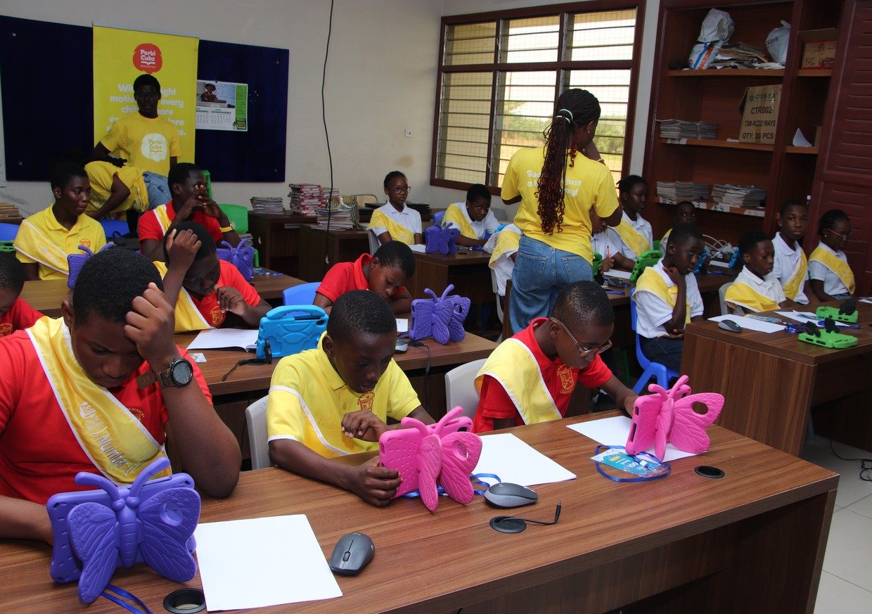 A class reading on tablets during a scheduled library session